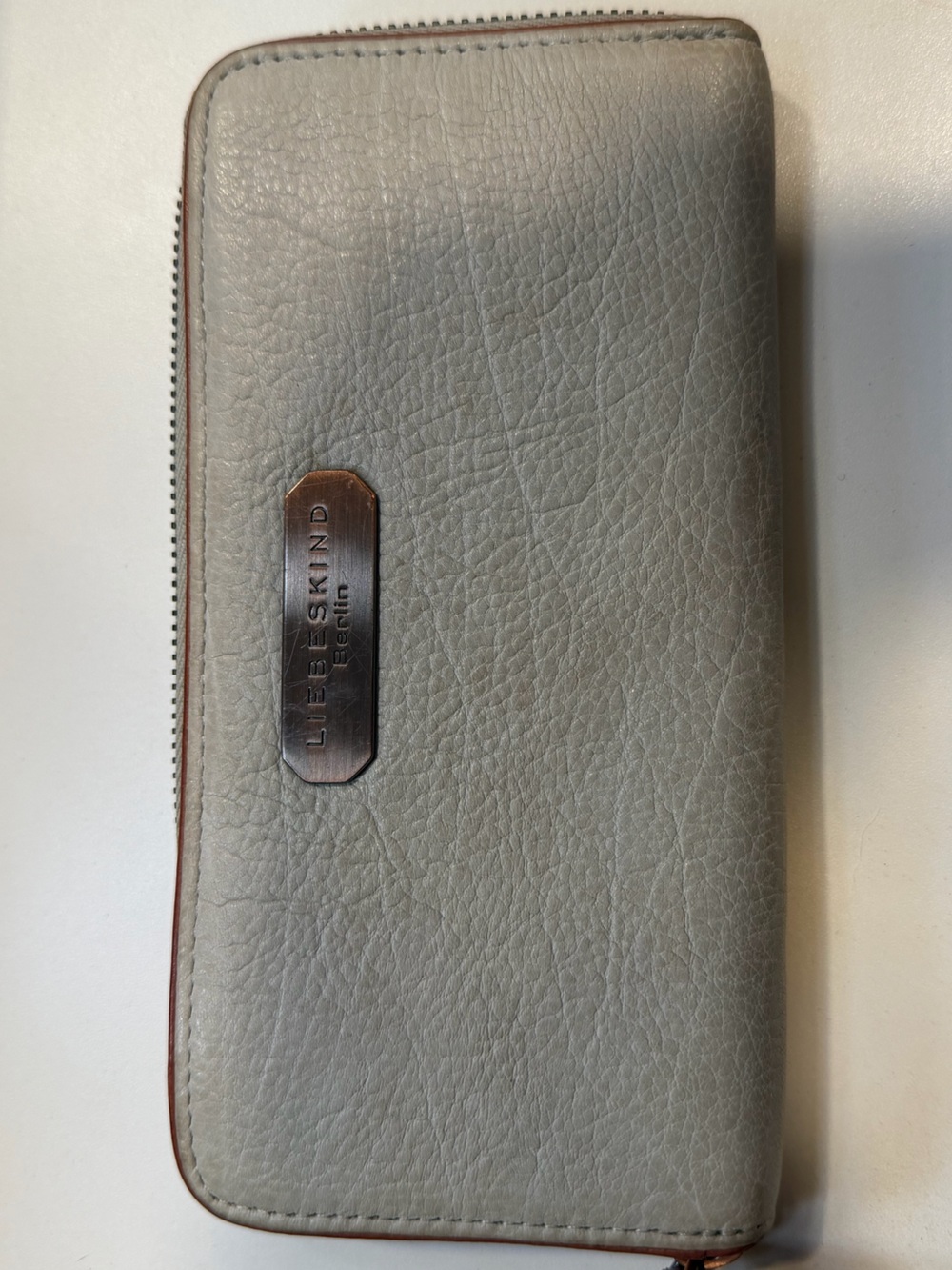 Liebeskind Berlin Pebbled Gray Leather Clutch with Metal Plaque